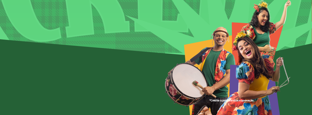 Imagem publicitária do banco Banese com temática de festa junina. Três pessoas estão em destaque, sorrindo e celebrando: um homem toca bumbo e veste camisa verde com colete colorido e chapéu de palha; ao lado, duas mulheres dançam com vestidos típicos e flores no cabelo. O fundo é verde com elementos coloridos como fogueira, bandeirolas e igrejas, reforçando o clima junino